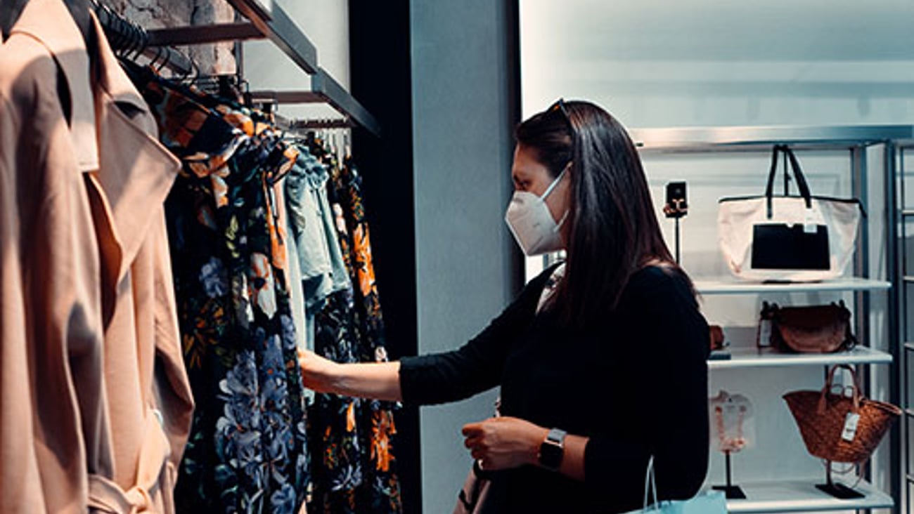 woman shopping in store wearing mask
