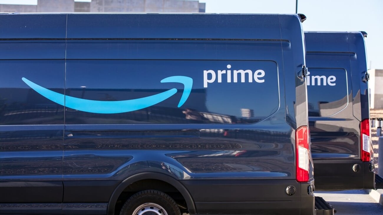 Henderson, NV, USA 10-15-2021: Blue Amazon Prime delivery van with its logo on the side of the car. Captured at the distribution facility center in the Las Vegas Valley area.; Shutterstock ID 2059925207
