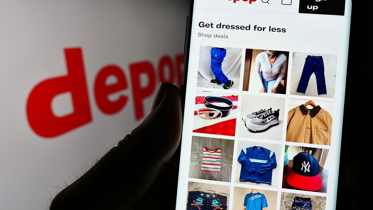 Stuttgart, Germany - 07-09-2023: Person holding cellphone with website of social e-commerce company Depop Limited on screen in front of logo. Focus on center of phone display. Unmodified photo.; Shutterstock ID 2335140141