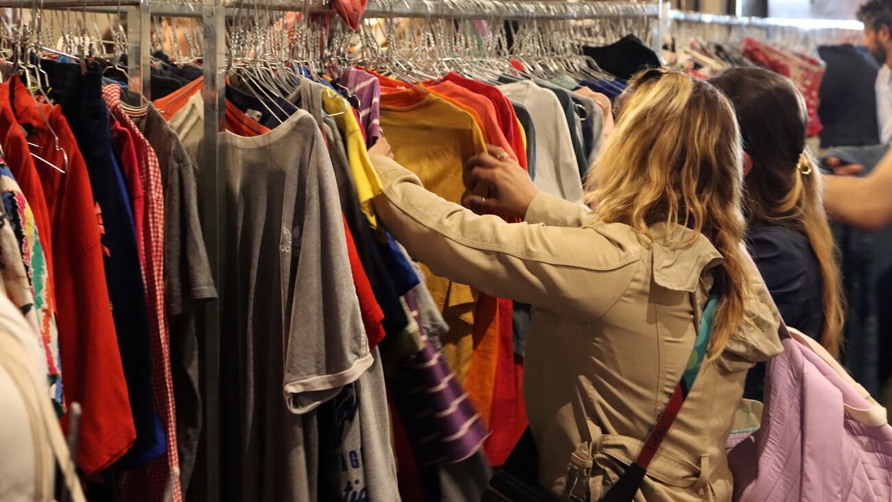 People buy vintage and second-hand clothes at a KiloShop. Clothing store, fashion. Puglia, Italy 01.06.2024; Shutterstock ID 2469752555