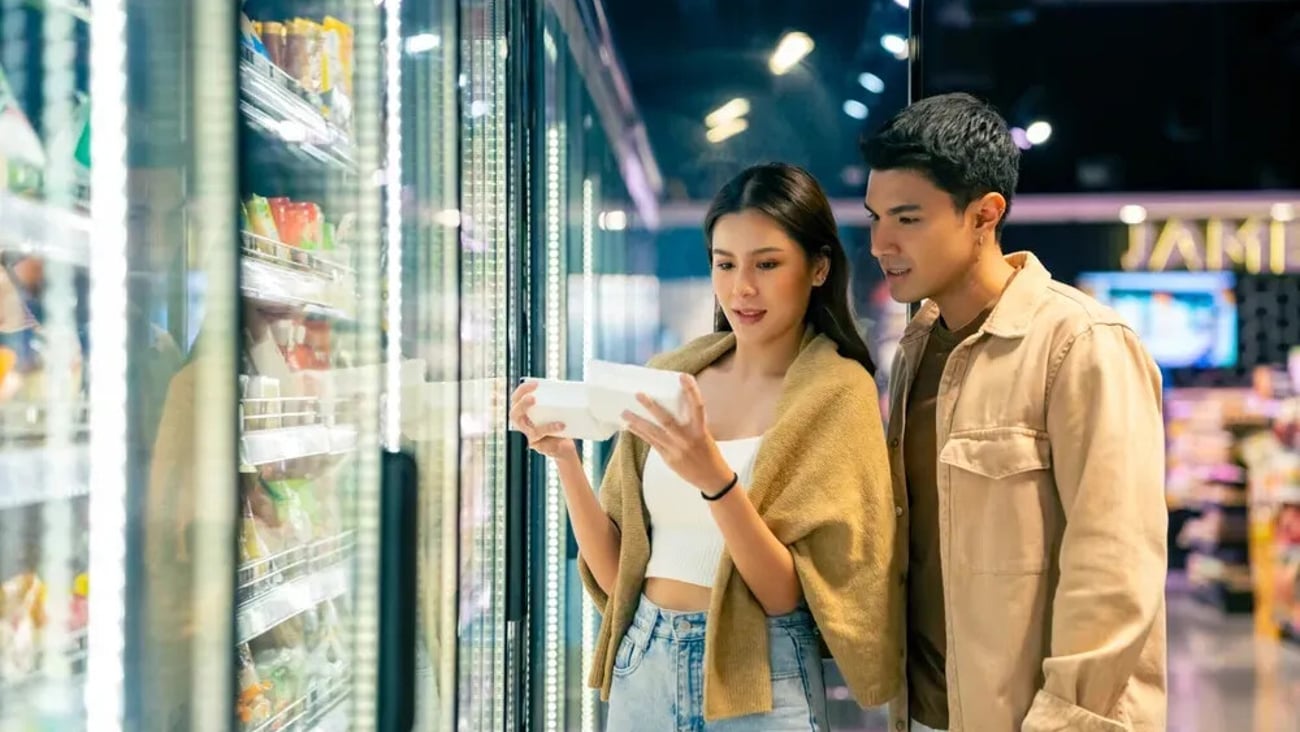 Happy Asian family couple shopping buying organic frozen food at supermarket. Man and woman customer with shopping cart walking, choosing food, groceries and reading product labels on fridge shelves.; Shutterstock ID 2614954151