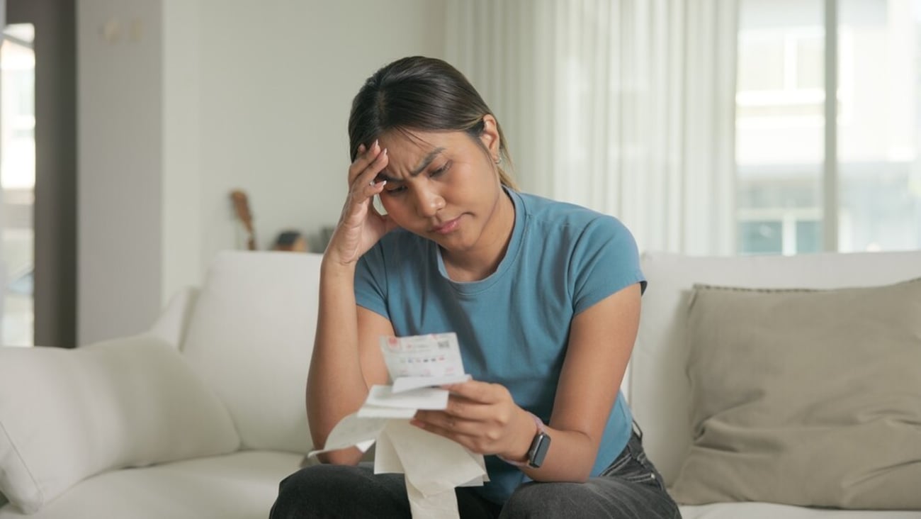 Cost of living low poor budget income black asia people Gen Z young adult woman. Looking opening Past due credit card bill debt home loan money issue asian worry tired stress in raise tax rate crisis.; Shutterstock ID 2650355361