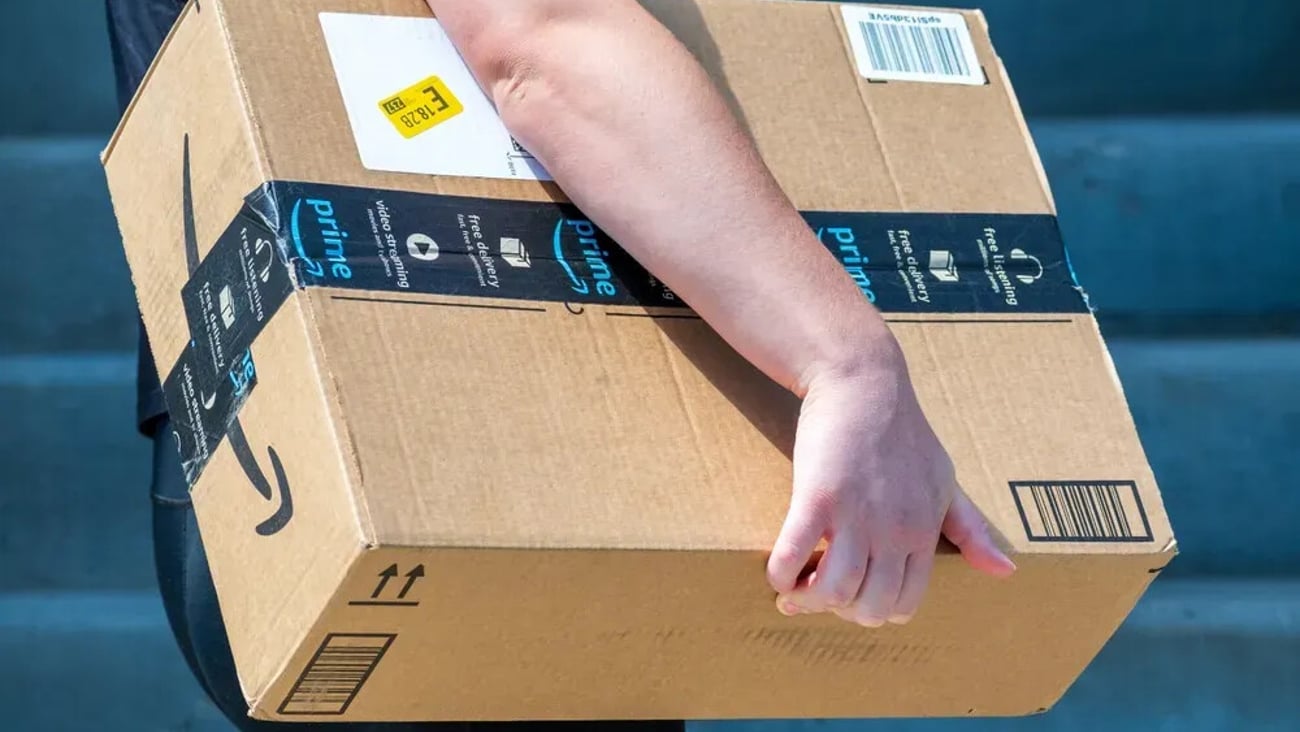 Salt Lake City, Utah, USA — September 1, 2025: An Amazon Flex driver delivers a large cardboard box to a residential doorstep. ; Shutterstock ID 2673275375