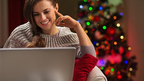 Woman shopping on laptop