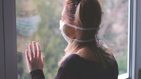 woman in isolation wearing mask