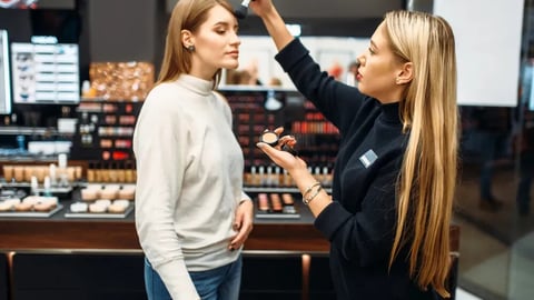 Seller and woman testing powder in make-up shop; Shutterstock ID 1399323866
