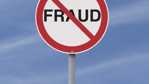 A modified road sign on Fraud  ; Shutterstock ID 142842217