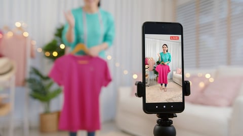 Asia vlogger woman influencer, SME retail store owner smile enjoy selling show live sale online screen in IG story reel tiktok work at home studio. Gen Z people record viral video selfie shoot app.; Shutterstock ID 2070498902