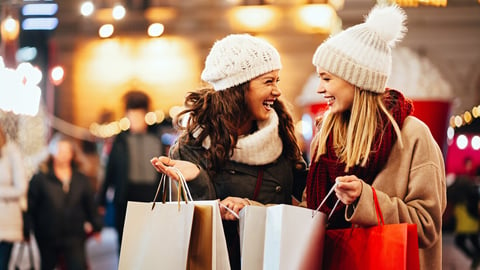 Happy women friends are shopping for presents at Christmas. People holiday sale shopping concept; Shutterstock ID 2376030343