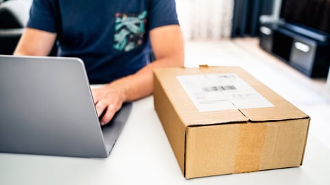 Return product package to online shop. Order delivery or shipment. Complaint and refund, ecommerce. Shipping wrong box back. Fake scam parcel. Damaged goods. Merchandise warranty. Man and computer.; Shutterstock ID 2386430645