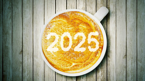 New year concept: Close up of number 2025 on frothy surface of cappuccino served in a cup above wooden table; Shutterstock ID 2498916977