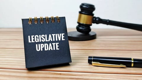 Legislative Update Text on Black Notepad with Judge Gavel and Pen on Wooden Table Representing Law Amendments Policy Change Governance. ; Shutterstock ID 2775431147