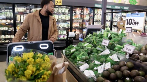 A shopper at an Amazon Fresh store (Photo: Amazon).