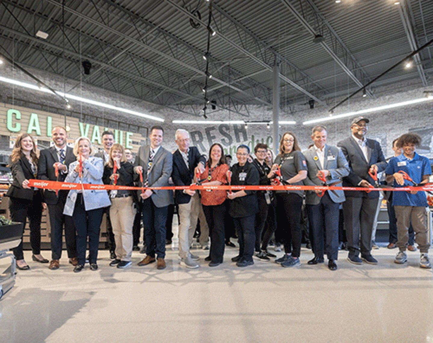 The Meijer team cuts the ribbon in the new Warren store.