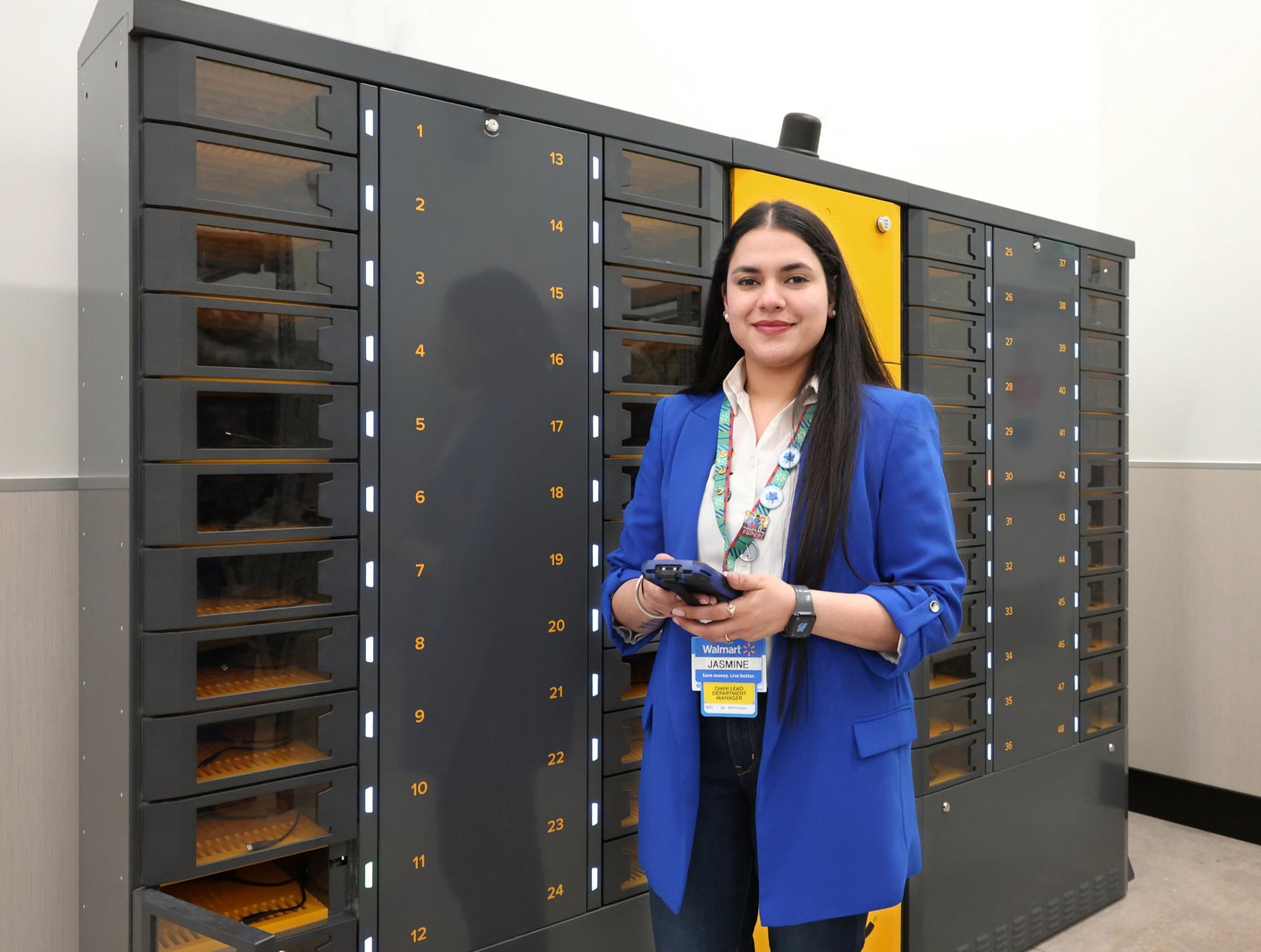 A Walmart Canada associate using an ARC smart locker (Photo: Walmart).