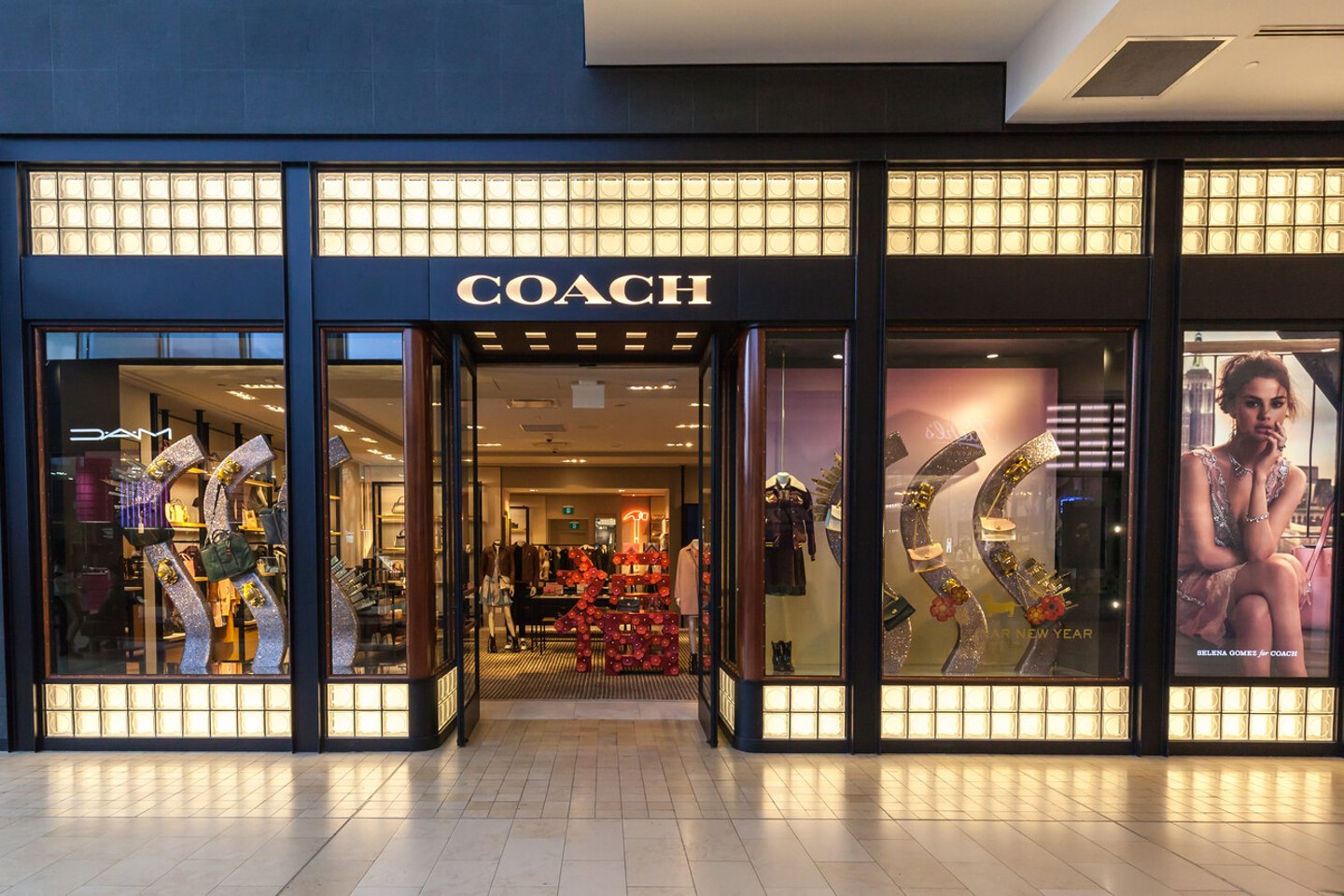 Toronto, Canada - February 23, 2018: Coach storefront in the shopping mall in Toronto. Coach is a leading design house of modern luxury accessories and lifestyle collections.; Shutterstock ID 1049898623