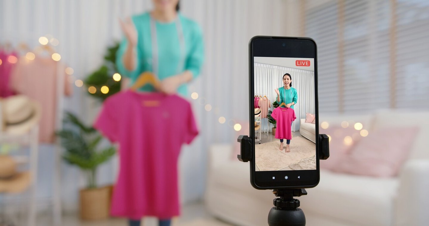 Asia vlogger woman influencer, SME retail store owner smile enjoy selling show live sale online screen in IG story reel tiktok work at home studio. Gen Z people record viral video selfie shoot app.; Shutterstock ID 2070498902