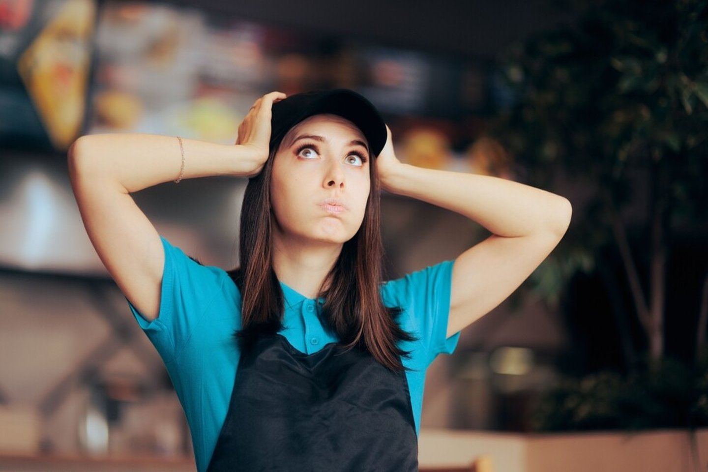 Stressed Fast Food Worker Feeling Overwhelmed Doing Overtime. Retail employee having an awful schedule feeling exhausted and desperate; Shutterstock ID 2137931143