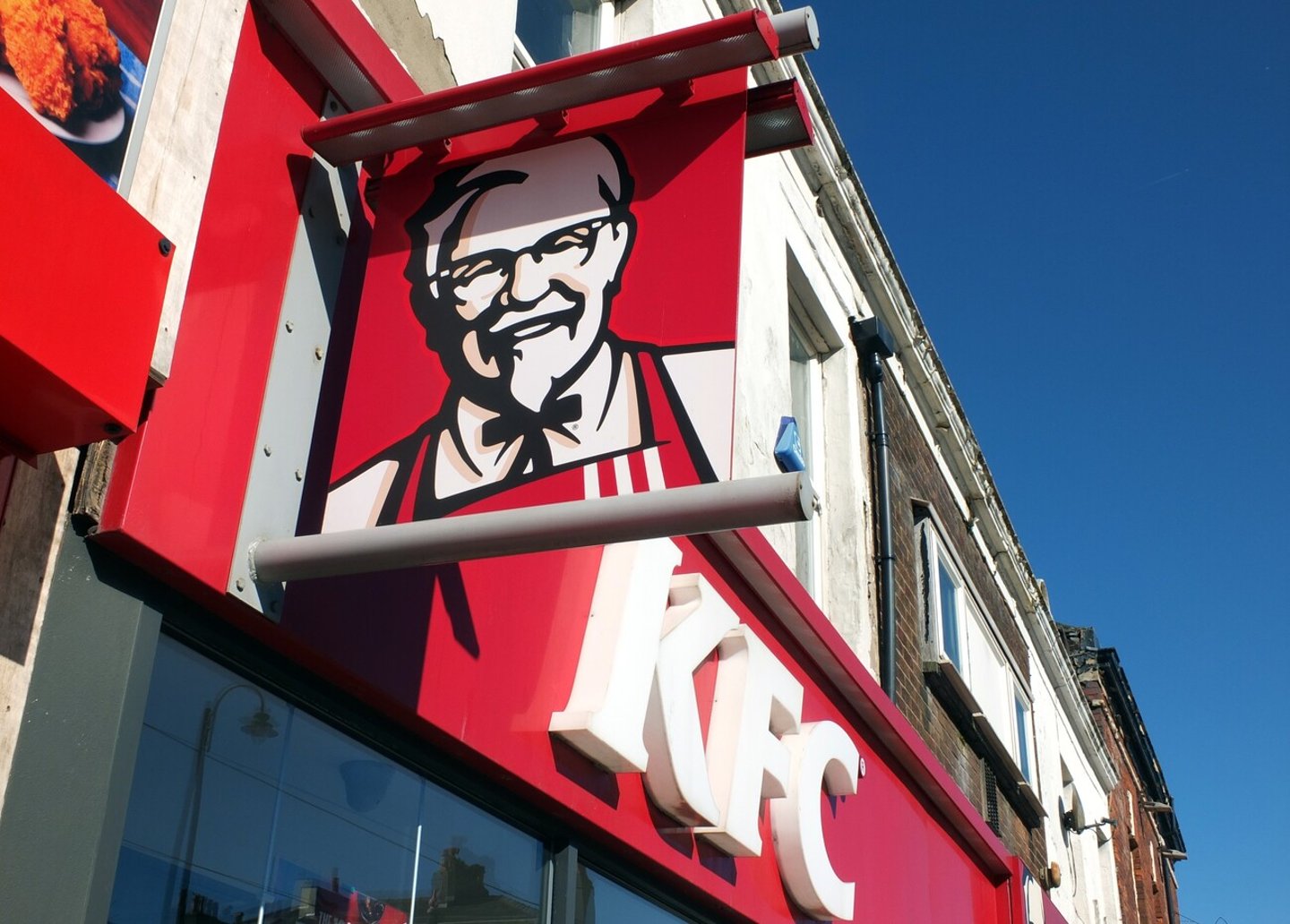 Fleetwood, Blackpool, Lancashire, United Kingdom - 5 March 2022: kfc sign and logo above a high street restaurant and takeaway in Fleetwood; Shutterstock ID 2143686921