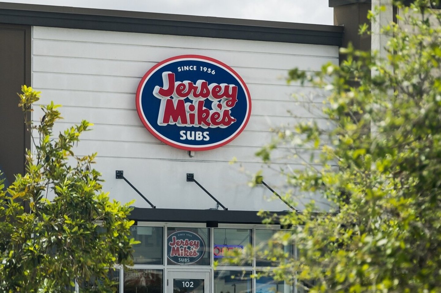 Miami, FL - Mar 22 2023: The sign of a Jersey Mike's graces the front of a building facade. ; Shutterstock ID 2279702825