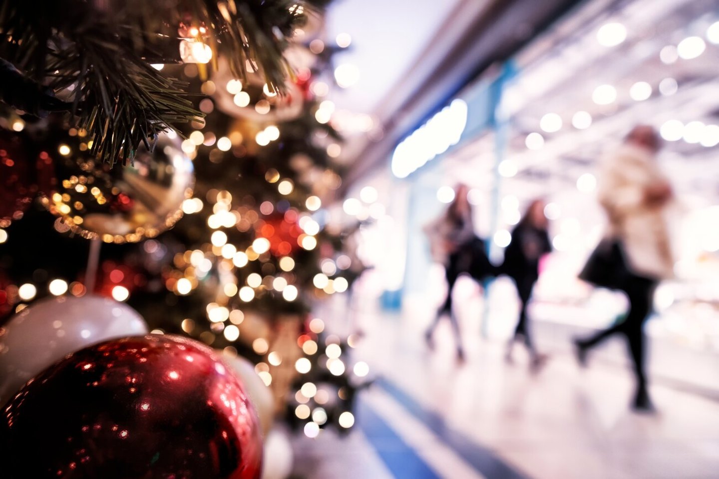 Christmas rush, Christmas lights with silhouettes of defocused shoppers in a shopping mall; Shutterstock ID 2364614633