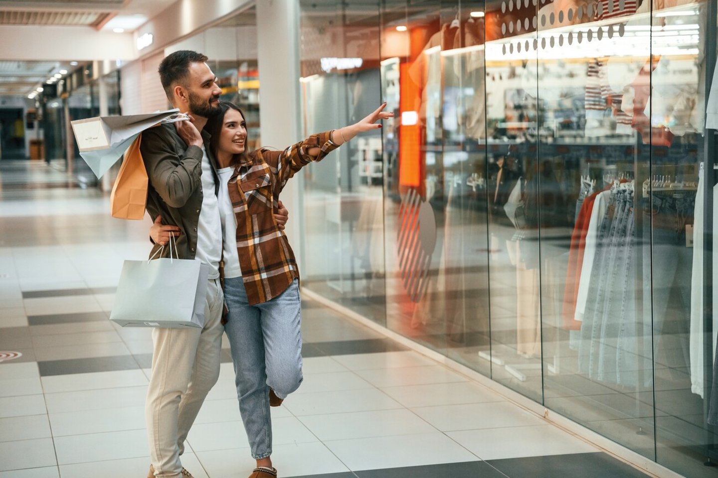 Conception of weekend and shopping. Young couple are in supermarket together.; Shutterstock ID 2447881521