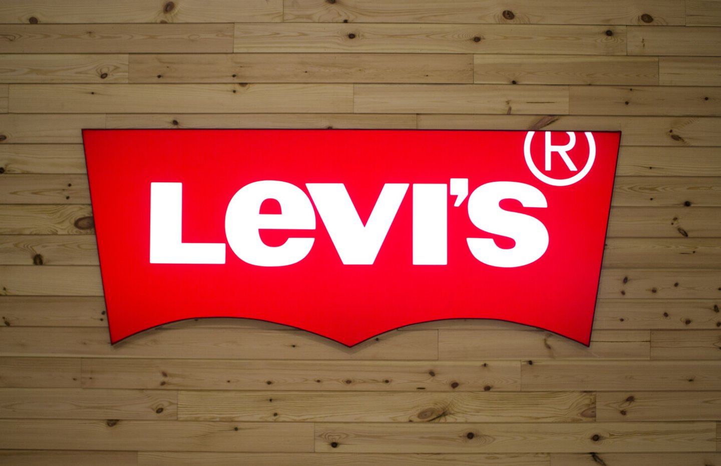Manila, Philippines - 26 June, 2016: Logo of famous brand "Levi's" in Manila, Philippines. Mass market jeans brand name. American style casual fashion wear. Levi's jeans logo close up photo; Shutterstock ID 458055625
