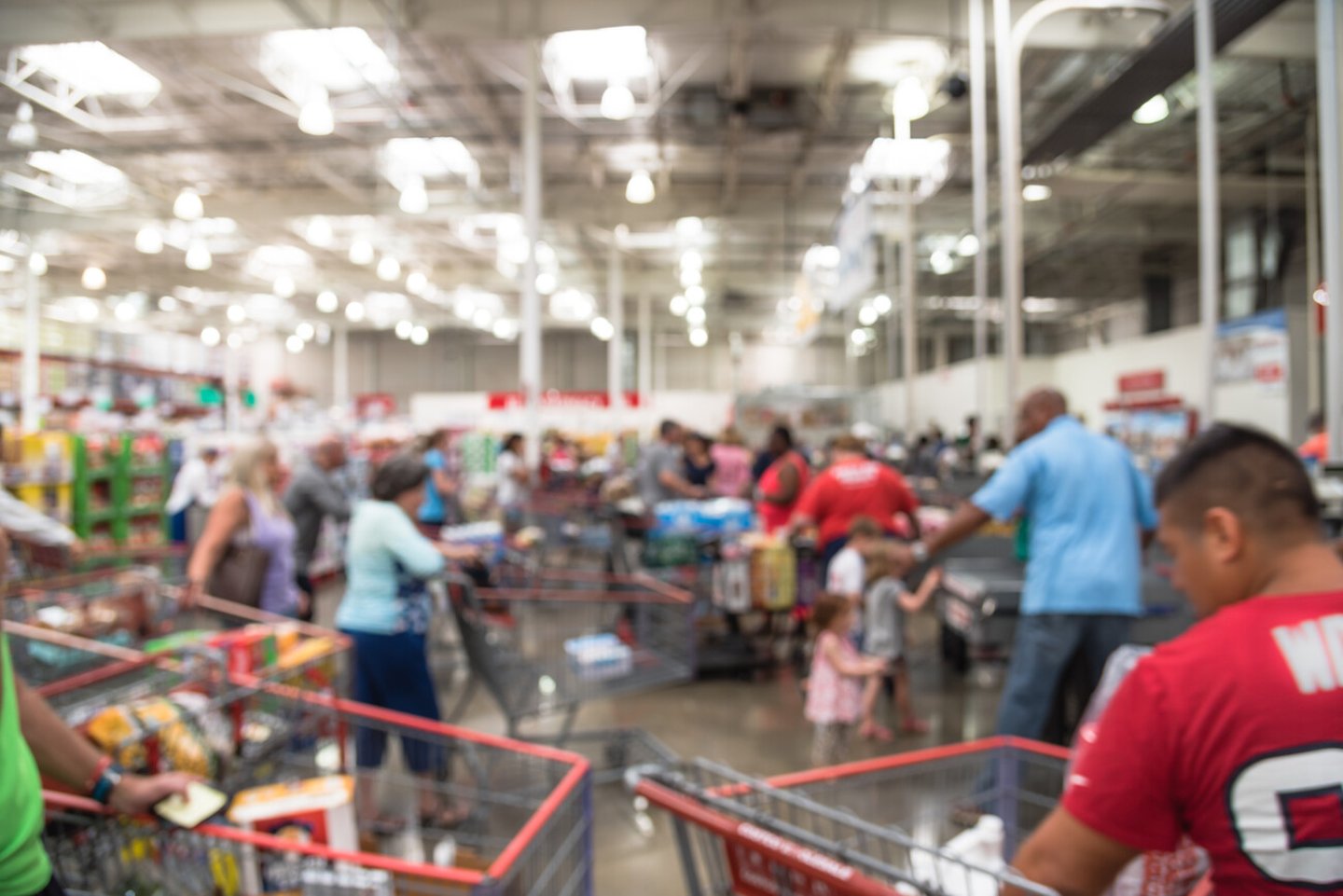 Blur image cashier with line of people at checkout counter. Customers paying with credit card to store employee in wholesale. Cashier register, computer on sales counter, checkout payment terminal.; Shutterstock ID 487455493