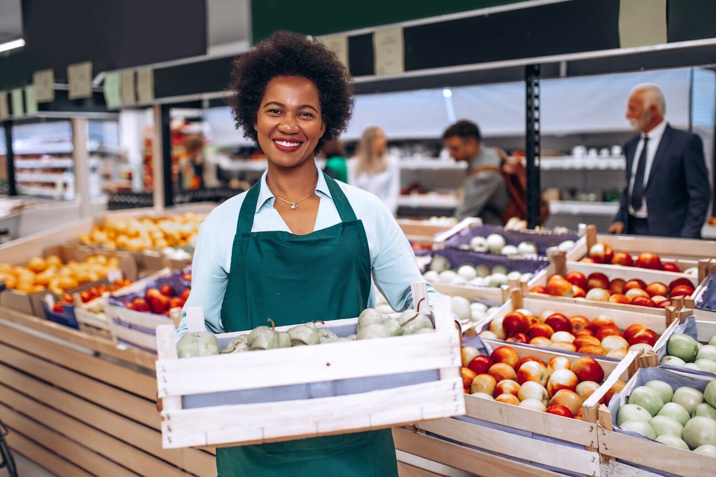 African American female employee working in grocery store.; Shutterstock ID 2180956731