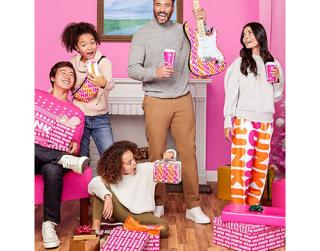People wearing Dunkin' products