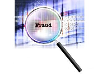 Magnifying glass with word "fraud"