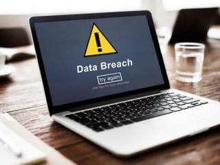 Laptop with data breach icon