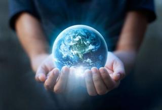 Person holding planet