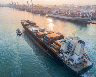 A deal between unions and employers at West Coast ports comes as the retail industry is entering the peak shipping season.