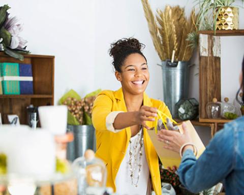 retailer employee helping customer