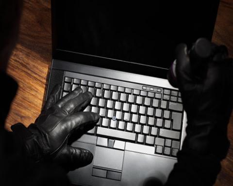 criminal at laptop