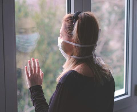 woman in isolation wearing mask