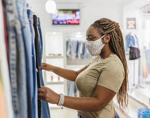 woman shopping in store wearing mask