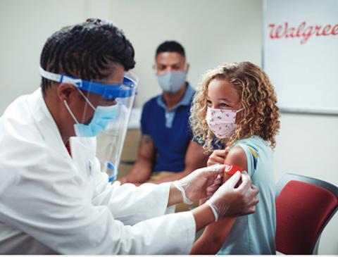 little girl getting a flu shot