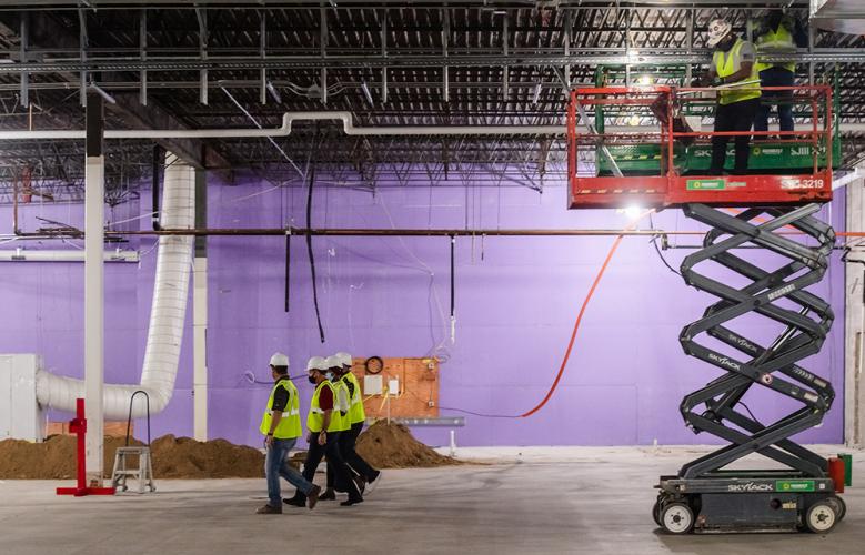 arget CEO Brian Cornell and Nawal Noor, CEO of Noor Companies, tour the Lake Street store with members of the construction team while work is underway.